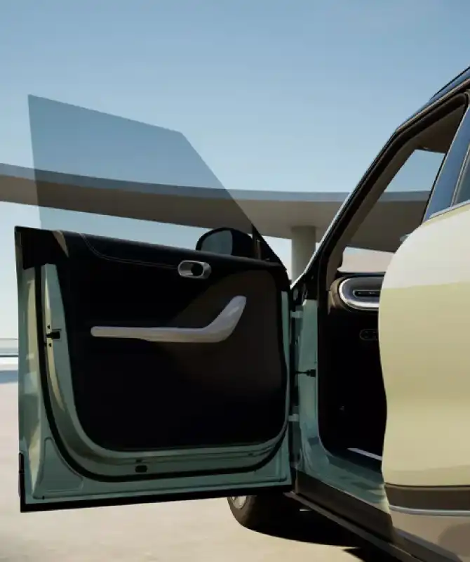 Close-up of a green smart #1 electric car with its front door open