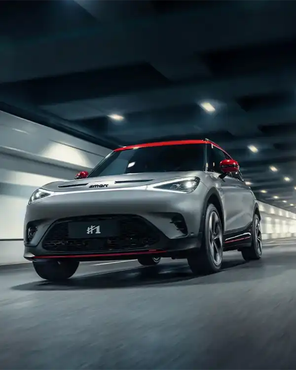 Grey smart #1 BRABUS electric car driving through a city tunnel
