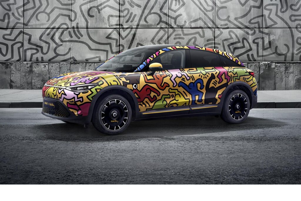 Front three quarter view of the smart #3 Keith Haring Art Car in a studio