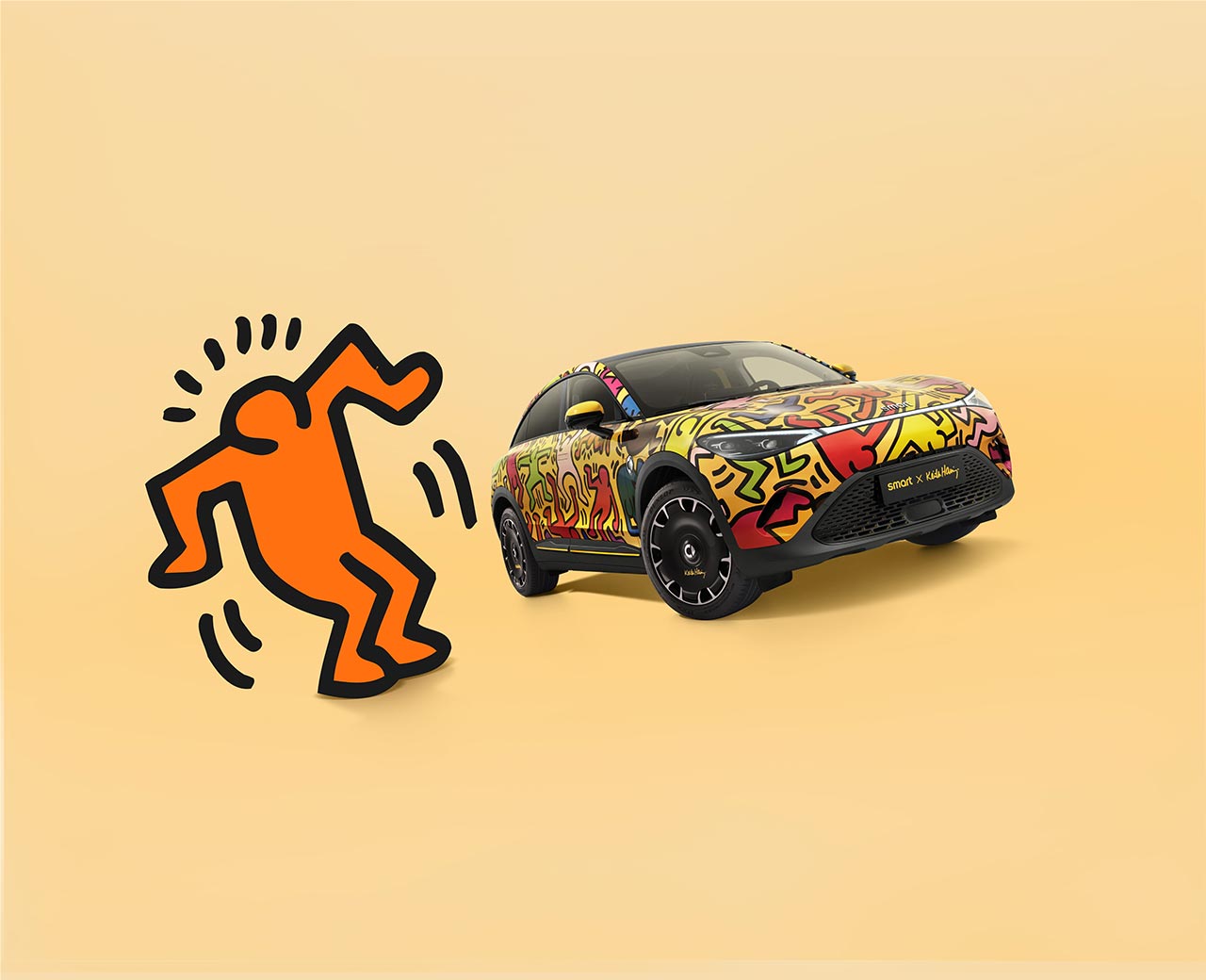 Front three quarter view of the smart #3 Keith Haring Art Car on a pale orange background with an orange Haring character next to the car