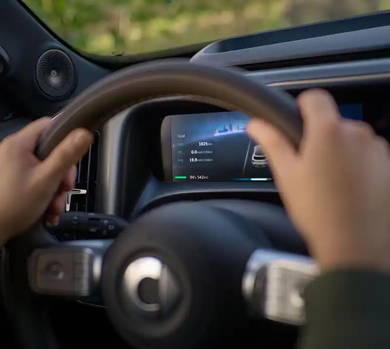 Close up of hands on a smart #5 electric SUV steering wheel