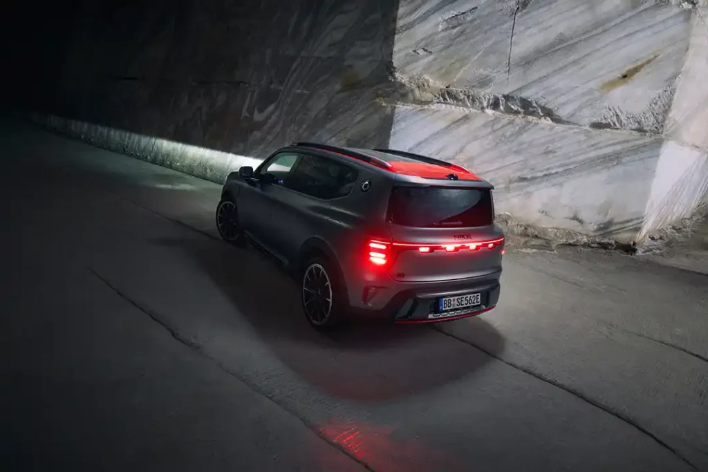 Rear three quarter view of a matte dark grey smart #5 BRABUS electric SUV with the dynamic tail lights showing