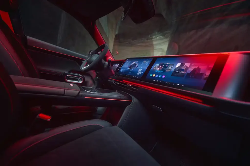 Interior view of the smart #5 BRABUS dashboard with large centre touchscreens and red ambient lighting