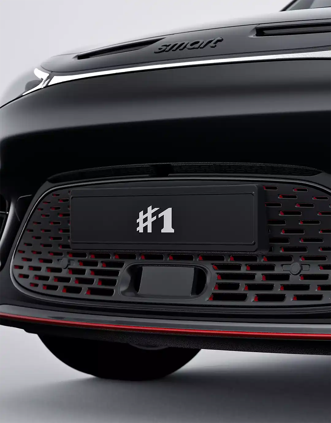 Close up of the front grille and BRABUS body kit on a black all-electric smart #1 BRABUS compact SUV