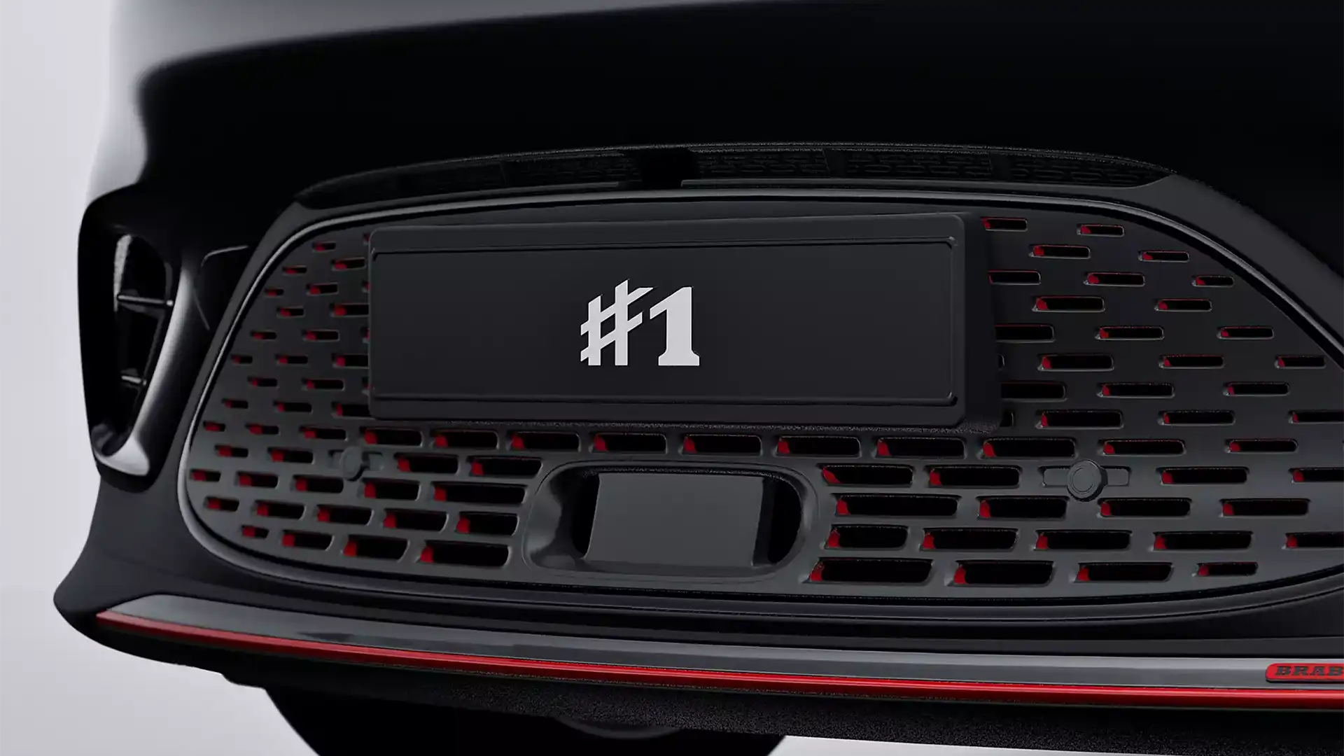 Close up of the front grille and BRABUS body kit on a black all-electric smart #1 BRABUS compact SUV