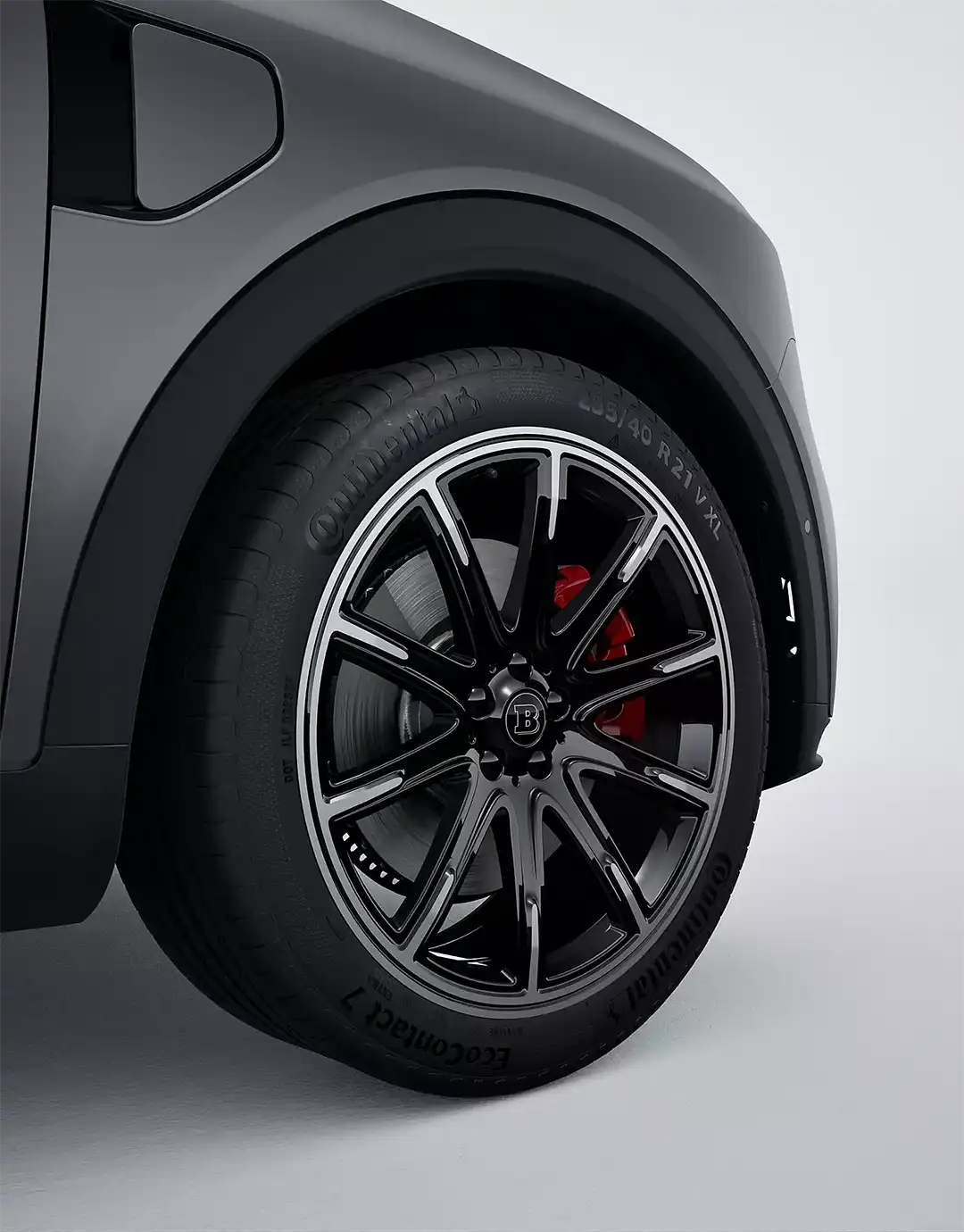 Close up of the front allow wheel with red brake callipers showing on an all-electric smart #1 BRABUS compact SUV