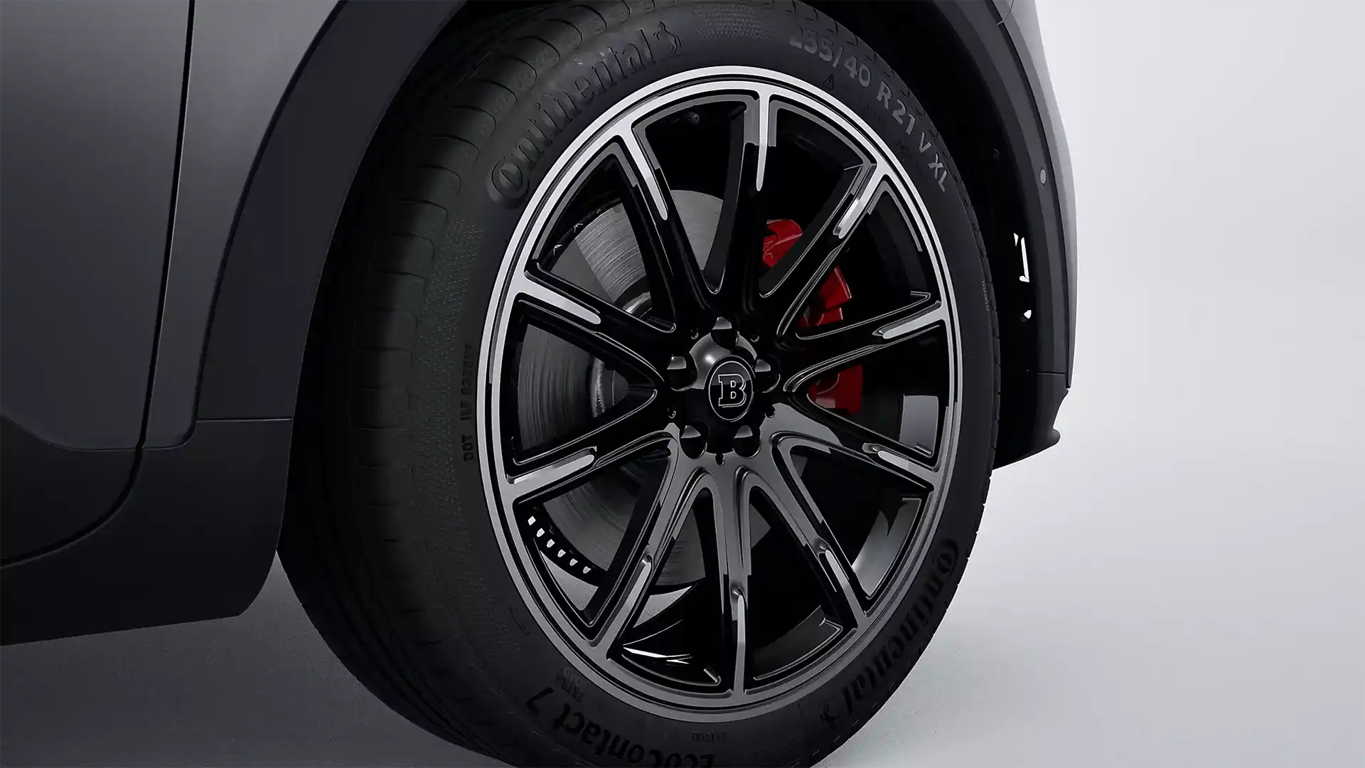 Close up of the front allow wheel with red brake callipers showing on an all-electric smart #1 BRABUS compact SUV